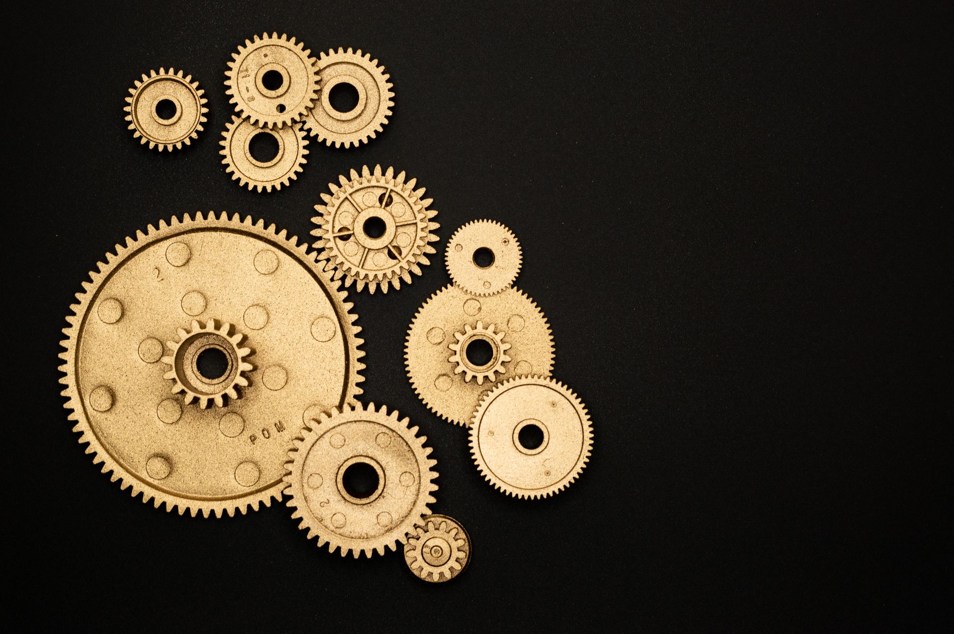Collection of mechanical gears on a black background